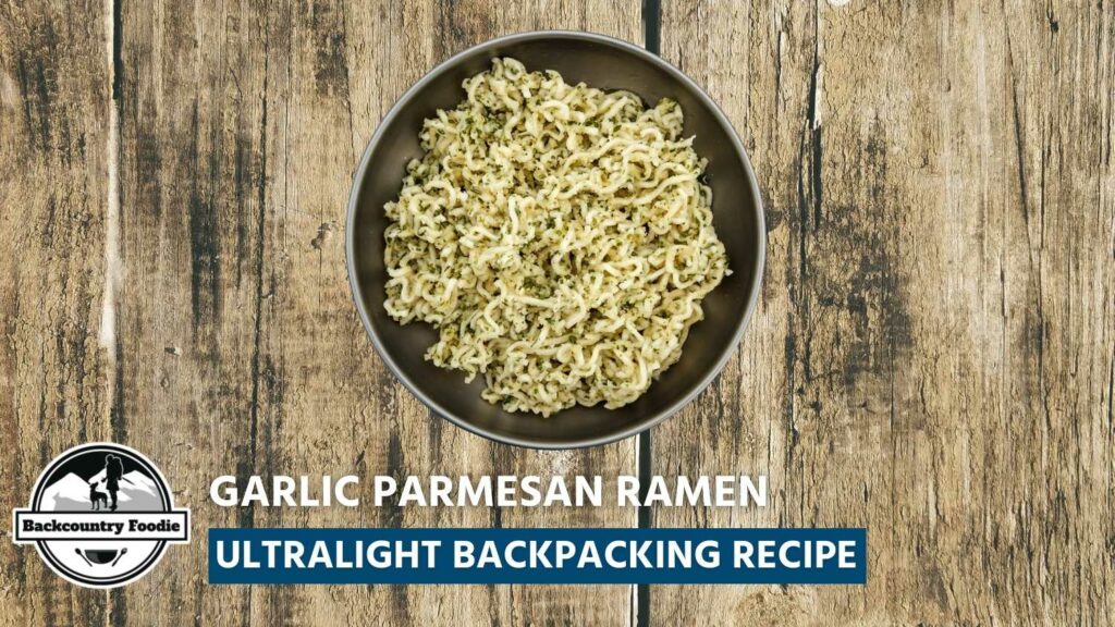 Are you new to making DIY backpacking meals or do you find preparing meals too time-consuming? Backcountry Foodie's ultralight Garlic Parmesan Ramen backpacking recipe takes less than 5 minutes to prepare and is hands down cheaper and tastier than most freeze-dried meals. It’s the perfect recipe to get you started and one of our go-to favorites. #backpackingmeal #hikingfoodideas #backpackingfoodideas #backpackingfood #hikingfood #hikingrecipes #backcountryfoodie