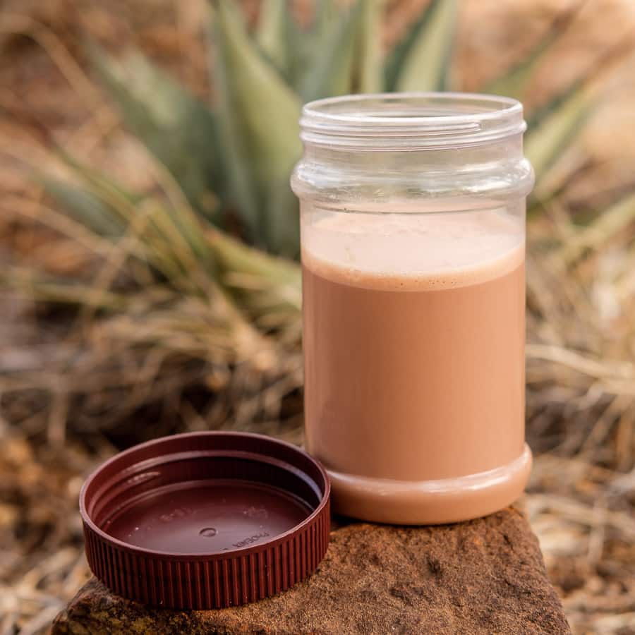 chocolate peanut butter shake backpacking recipe prepared on trail
