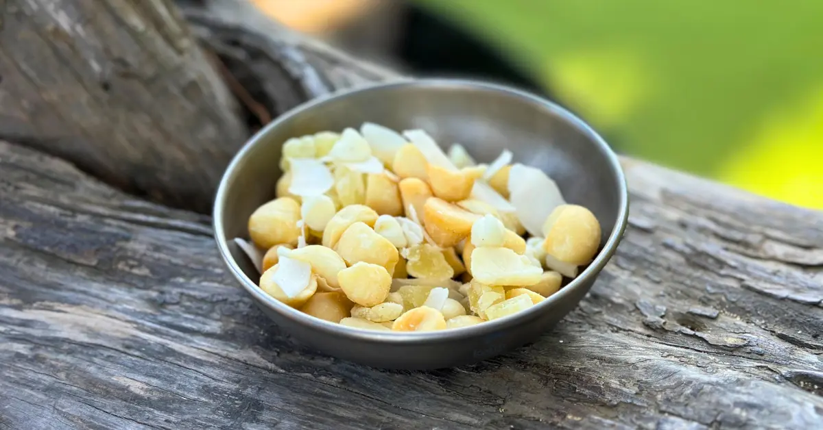 aloha trail mix in plate on log