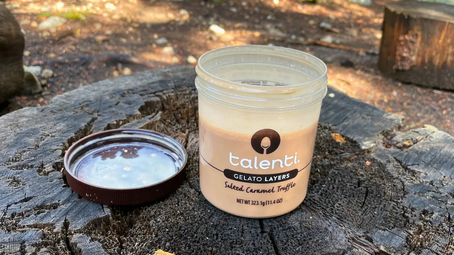 chocolate peanut butter shake in jar on tree stump thumbnail image