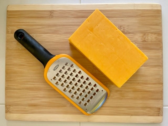 If you love cheese but can't stand the thought of going without it on your next backpacking trip, never fear! With a minimal effort, you can dry your own cheese at home. Doing so not only lightens your load but makes DIY backpacking meals taste that much better! #hikingfoodideas #diybackpackingfood #besthikingfood #howtofreezedry #backcountryfoodie