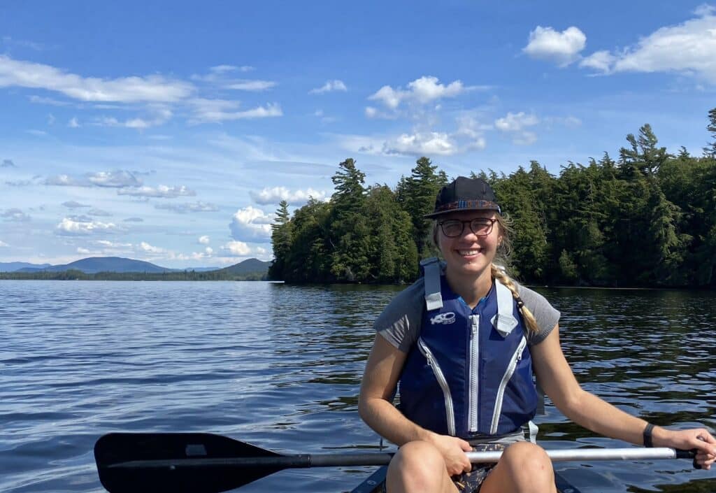 Author Sarah Coupal paddling in a canoe