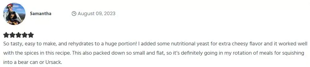 Screenshot of a 5-star member review by Samantha from August 9, 2023. She says the backpacking couscous recipe is tasty, easy to make, rehydrates to a large portion, and packs flat for fitting into a bear can or Ursack. She mentions adding nutritional yeast for extra cheesy flavor.