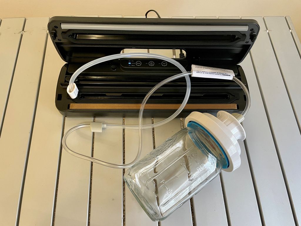Vacuum sealer and mason jar with vacuum sealer accessory for packaging dried tuna