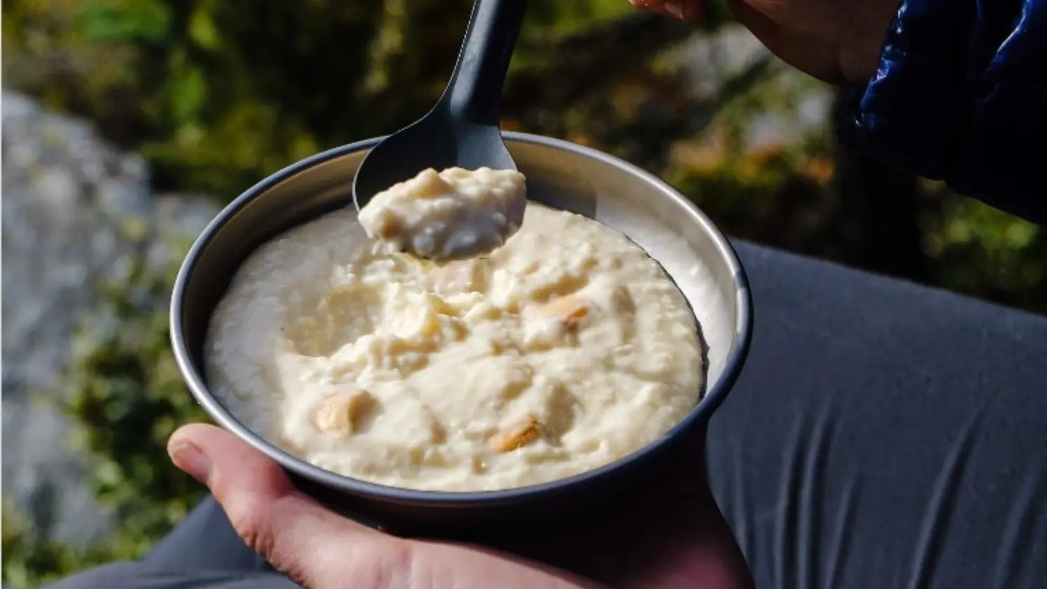 white chocolate pudding hiker holding plate with spoon thumbnail image
